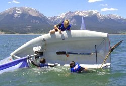 capsized sailing dinghy